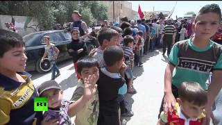 Военные РФ доставили гумпомощь в сирийский город Муадамия