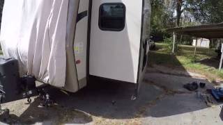 Recentering a slideout on a travel trailer equipped with Lippert Electric Slides