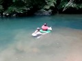 Christa pushes Lissa down the Rio Tanama