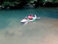 Christa pushes Lissa down the Rio Tanama
