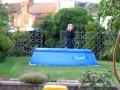Girl running and jumping into pool accident