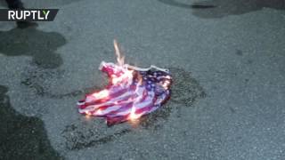 В Греции флаг США сожгли в знак протеста против визита Обамы