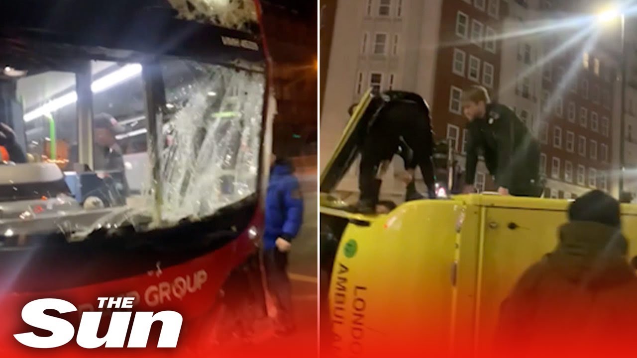 Ambulance FLIPS OVER after crash with London double decker bus