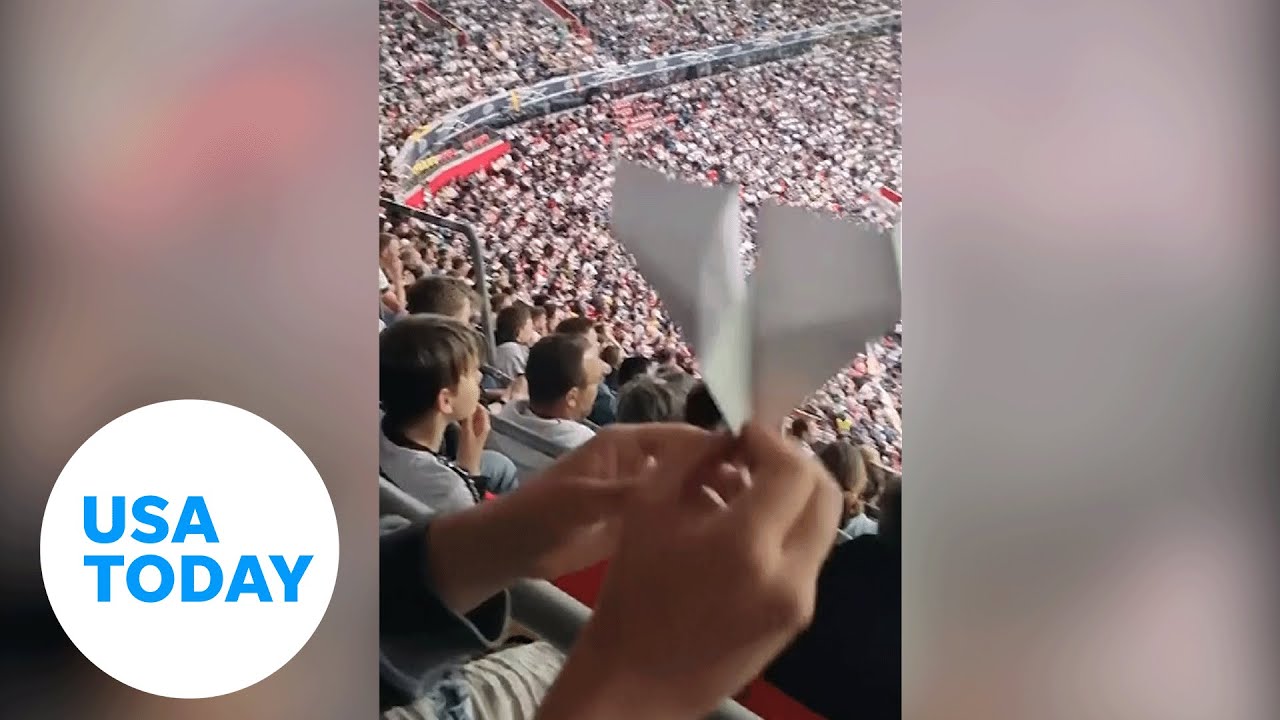 Soccer fan scores a goal from the stands with a paper airplane | USA TODAY
