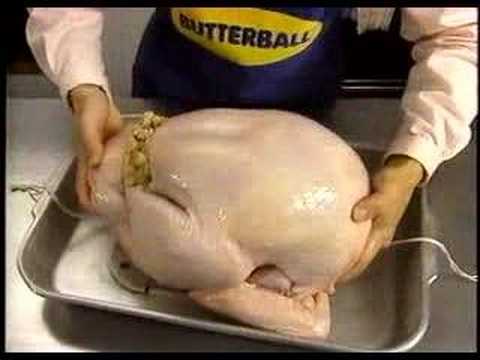 Uncomfortable woman teaches how to cook a turkey