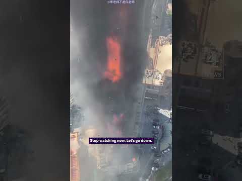 Huge fire engulfs high-rise in China