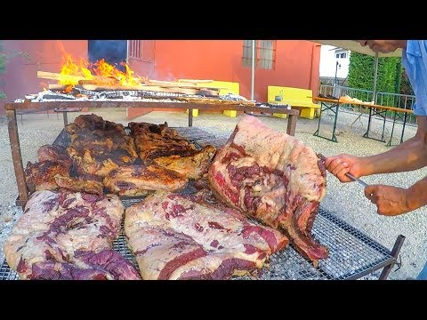 Argentinian Grill Master Roasts Huge Blocks of Bull Meat. Italy Street Food Festival - UCdNO3SSyxVGqW-xKmIVv9pQ