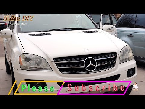 Come sostituire le lampadine dei fari anteriori nella Mercedes Classe M?