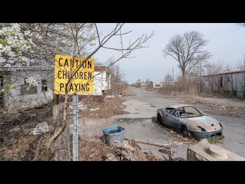 Evacuated American Ghost Town with streets of vacant homes/cars