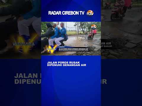 Jalan Poros Rusak Dipenuhi Genangan Air