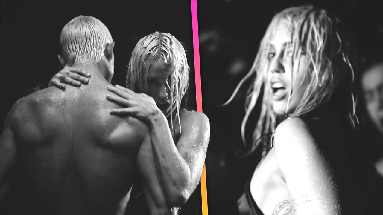 Miley Cyrus Dances With SHIRTLESS Men in River Video