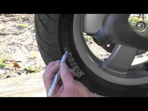 Filling in the Letters on Tire with Silver Sharpie Marker - UCTs-d2DgyuJVRICivxe2Ktg