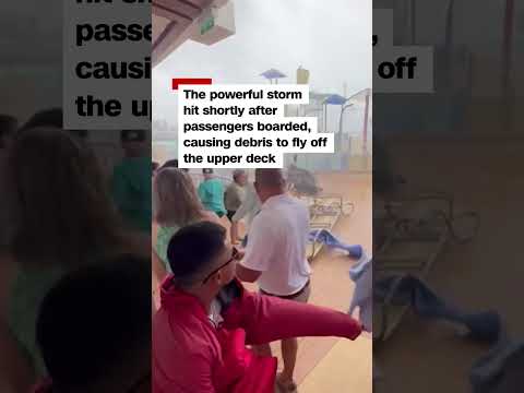 Watch cruise passengers flee flying lounge chairs, debris as storm hits