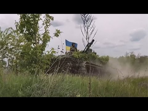 Ukraine soldiers use captured Russian BMP-3 tracked armored IFV Infantry Fighting Vehicle