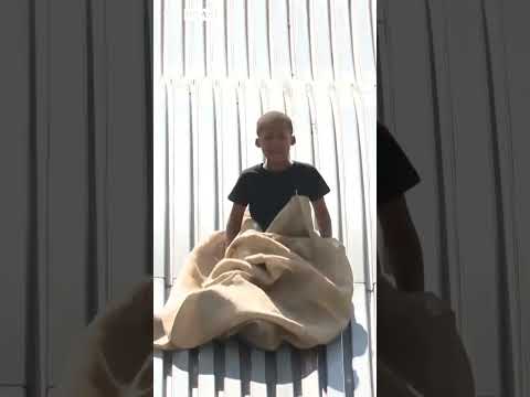 Giant slide reopens in Detroit with softer landing