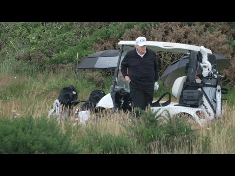 US President Donald Trump plays golf at his Turnberry resort in Scotland | AFP