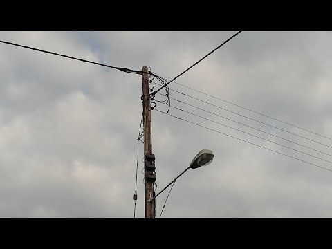 Thick, black ribbed overhead power lines.  Including ABC termination. - UCtM5z2gkrGRuWd0JQMx76qA