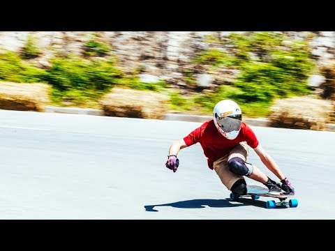 POV Downhill Longboarding with a Twist: No Hands Allowed | Red Bull No Paws Down - UCblfuW_4rakIf2h6aqANefA