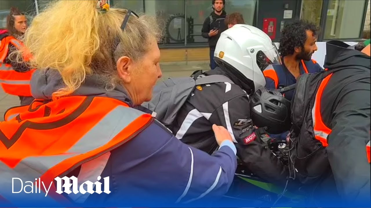 Angry motorcyclist ploughs through Just Stop Oil protest in London as tensions rise