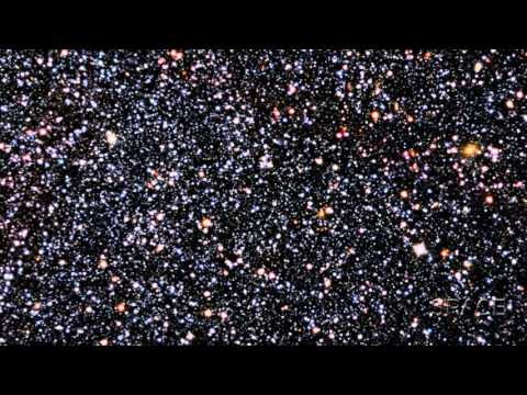 Dwarf Galaxy, Hiding In Plain Sight, Frames Distant Large Galaxies | Video - UCVTomc35agH1SM6kCKzwW_g