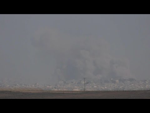 Clouds of smoke rise from north Gaza Strip seen from the Israeli side of the border | AFP