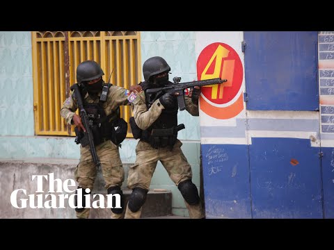 Haiti unrest: armed gangs target international airport after mass jailbreak