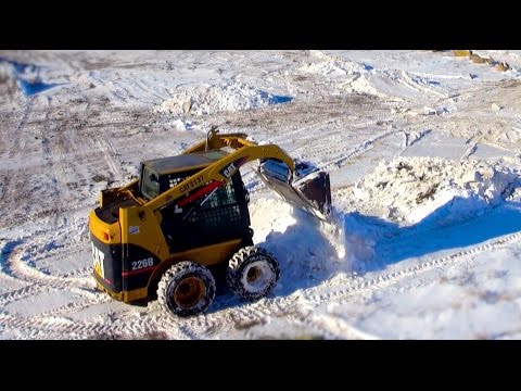 RC ADVENTURES -  Who's controlling the Radio?! Cat 226b Turbo Skid-steer building Jumps - UCxcjVHL-2o3D6Q9esu05a1Q