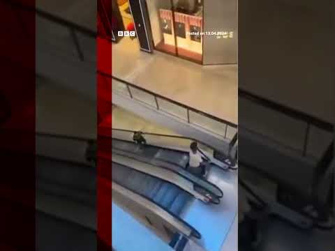 A civilian was filmed confronting the Sydney knifeman on the mall escalators. #Shorts #BBCNews
