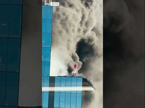 Worker rescued from high-rise fire by crane