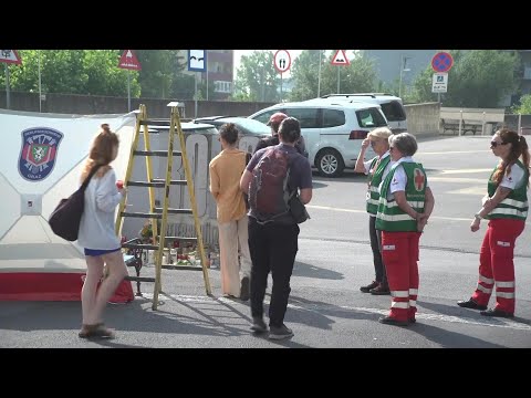 Mourners visit memorial at the site of Austria school shooting | AFP
