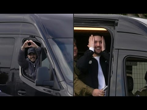 Two released Israeli hostages wave to crowd after arriving at hospital | AFP