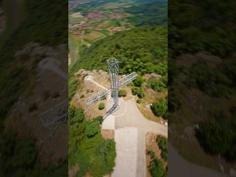 FPV Drone circling around the Cross and diving down into the Valley