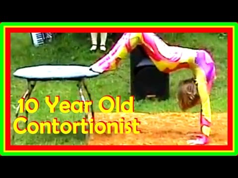 Contorortionist Next Door: Contortion Act On A Table Outdoors In A Summer Camp Contorortionist Next Door: Contortion Act On A Table Outdoors In A Summer Camp