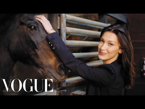  Bella Hadid takes Vogue along to a charming horse stable and answers 73 original questions. While Bella feeds horses and cuddles a baby goat, she talks about her modeling career and where she's at at this point in her life. Bella discusses her love of horse riding, her obsession with chocolate, and ongoing passion for photography.