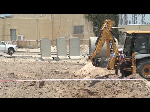 Excavator at site of Iranian missile strike in southern Israel | AFP