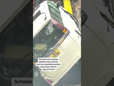 Hong Kong: Cars stuck in craters as streets are flooded