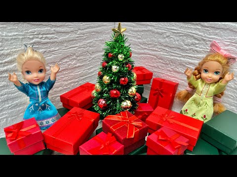 Elsa and Anna toddlers open their Christmas presents