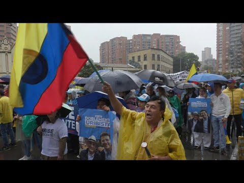 Supporters of Colombian ex-president Uribe march following sentence | AFP