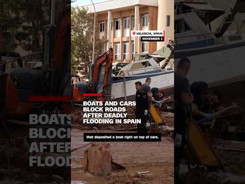 Boats and cars block roads after deadly flooding in Spain