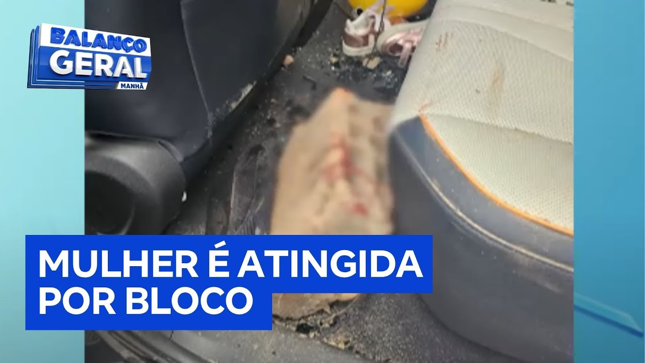 Mulher fica gravemente ferida após bloco de concreto atingir carro