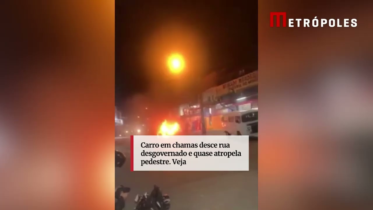 Carro em chamas desce rua desgovernado e quase atropela pedestre Veja