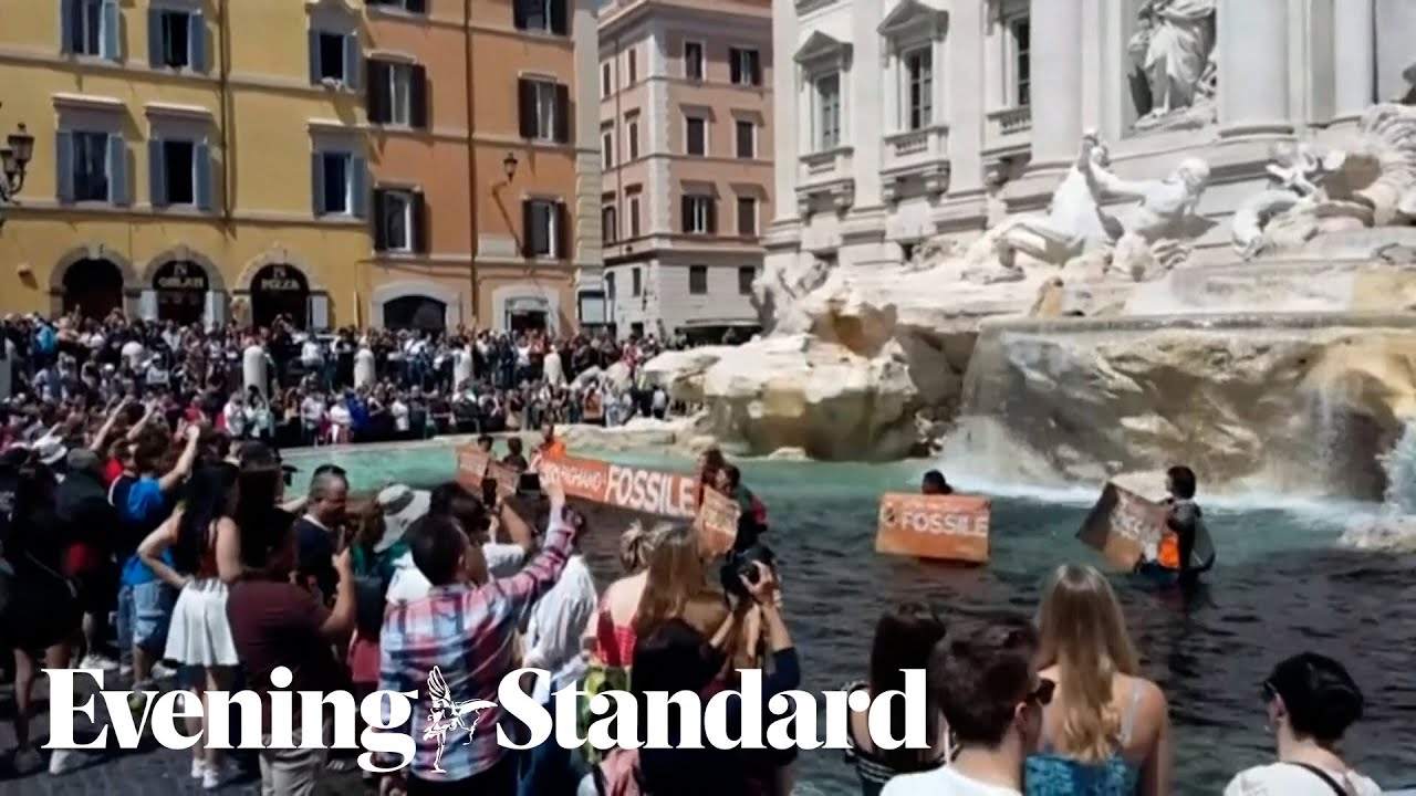 Watch: Moment climate change activists pour black liquid into Trevi Fountain