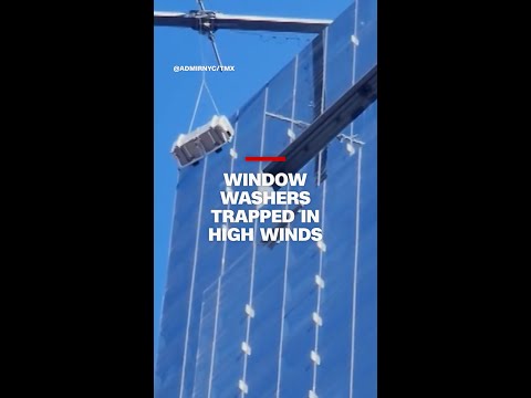 Window washers trapped in high winds
