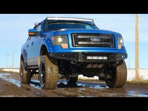 Lifted Ford F-150 4x4 hits a Mud Puddle on Icy Dirt Road - UCxcjVHL-2o3D6Q9esu05a1Q