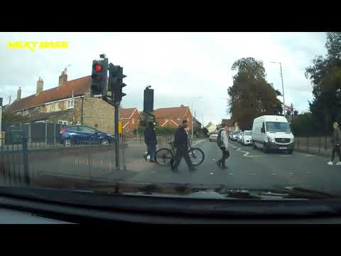 Cyclist Rides Straight Through a Red Traffic Light #DashCam #Cyclist #Driving 