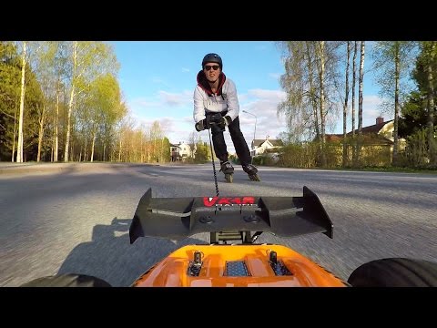 RC CAR PULLS GUY ON ROLLERSKATES - AWESOME! - UC873OURVczg_utAk8dXx_Uw