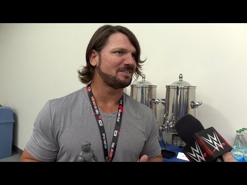 AJ Styles reacts to his action figure at SDCC 2016 - UCJ5v_MCY6GNUBTO8-D3XoAg