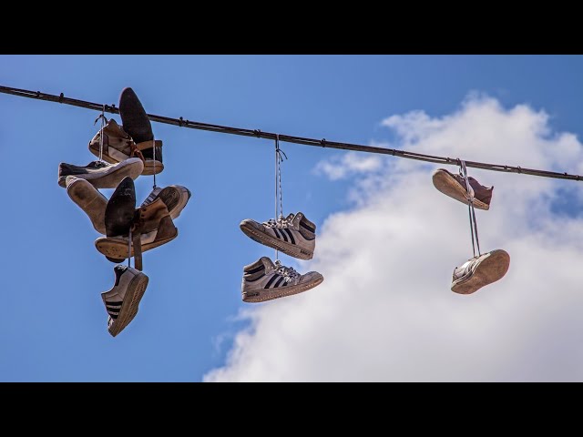 What Does Tennis Shoes Hanging From A Powerline Mean?
