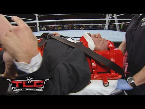 Triple H helped by paramedics after being attacked by Roman Reigns: WWE.com Exclusive, Dec. 13, 2015 - UCJ5v_MCY6GNUBTO8-D3XoAg