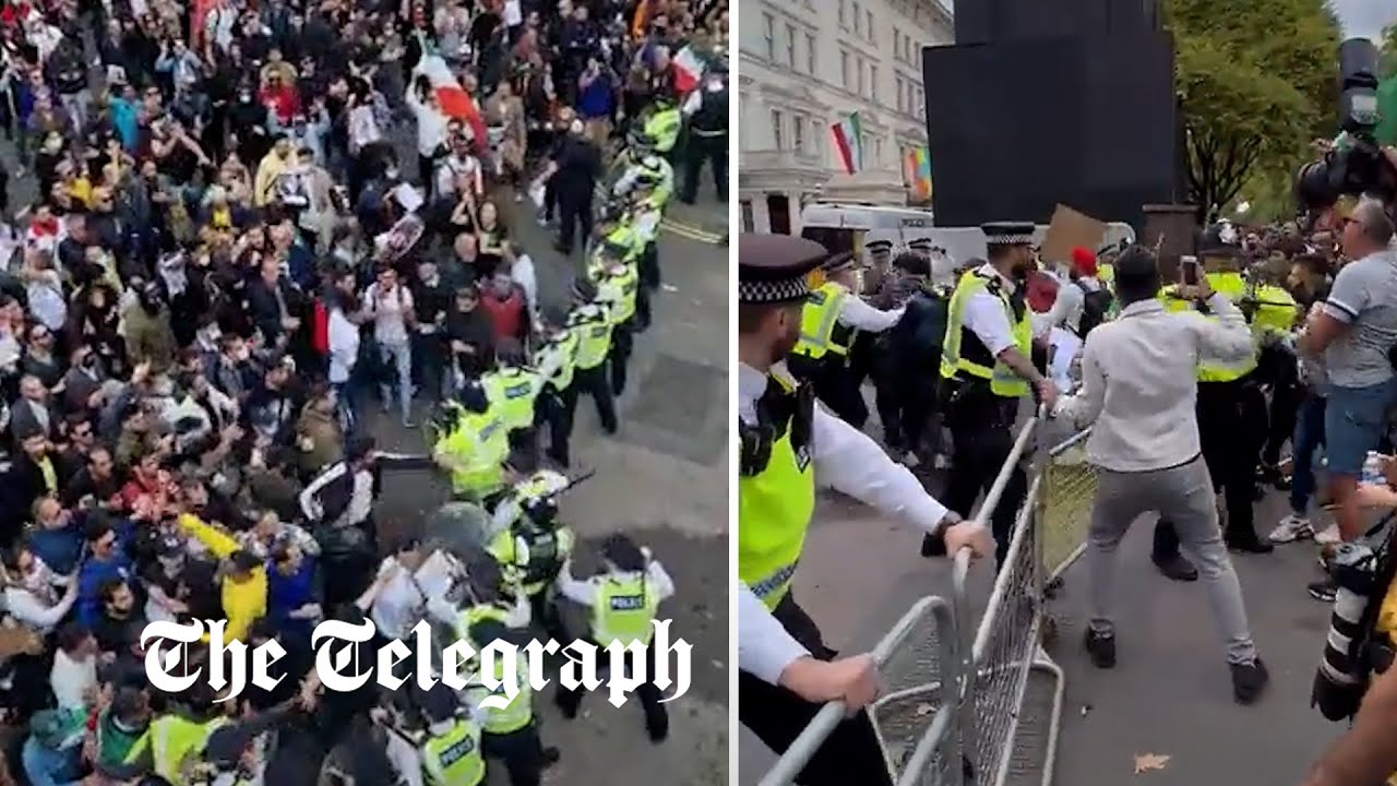 Dozens of protesters clash with police outside Iranian embassy in London
